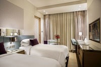 Two-bedroom suite, kitchenette, workspace.