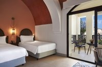 Cozy Nubian-inspired rooms with balcony.