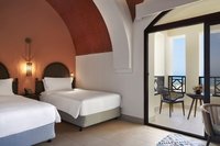 Mediterranean style, lagoon views, king/twin beds.