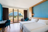Comfortable city-view room with balcony.